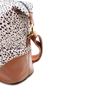 
                  
                    luna weekender cheetah spot zipper detail view travel duffel
                  
                